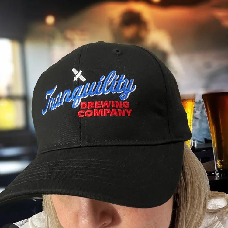 Tranquility Brewing Company hat in the bar.