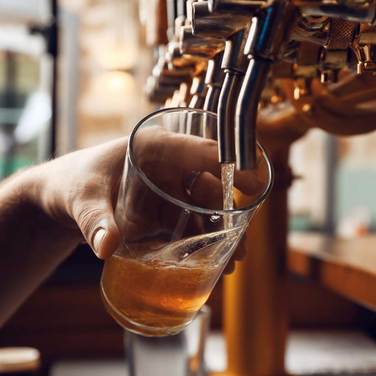 Pouring a beer. Tranquility Bar's on-tap menu is always changing.